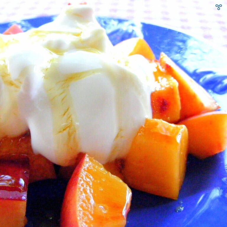 Chopped nectarine pieces topped with natural yoghurt and honey