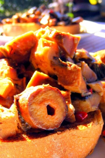 Chopped cooked mushrooms on top of toasted bread.