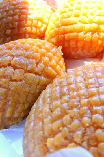 Four Turkish sponge cakes with a crisscross pattern stamped over the top.