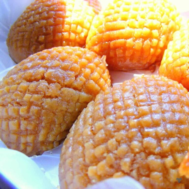 Four Turkish sponge cakes with a crisscross pattern stamped over the top.