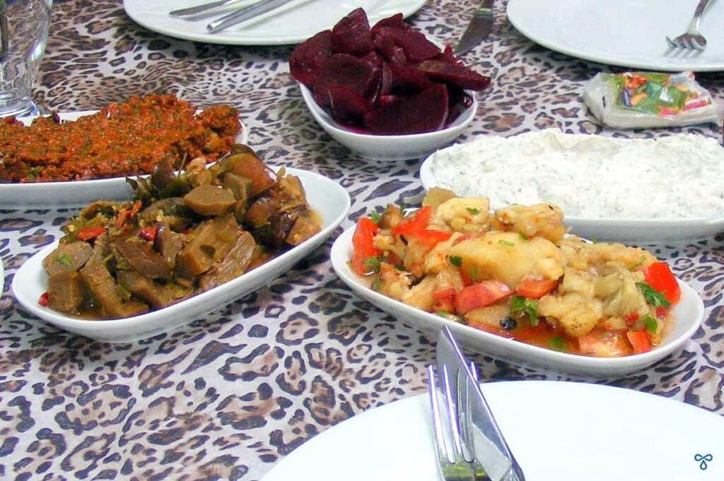 A selection of meze plates featuring haydari yoghurt dip, beetroot, ezme and aubergine salad.