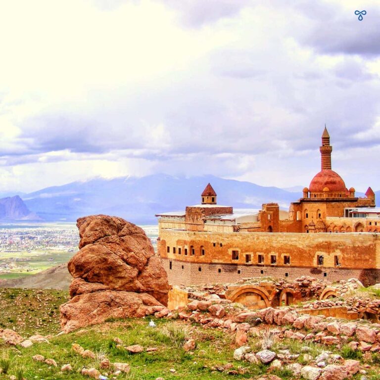 Ishak Paşa Sarayı viewed from the hillside behind. Mount Ararat is cloud-covered in the distance.