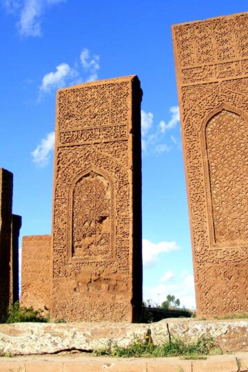 Three intricately-carved Ahlat tombstones, going up in height.