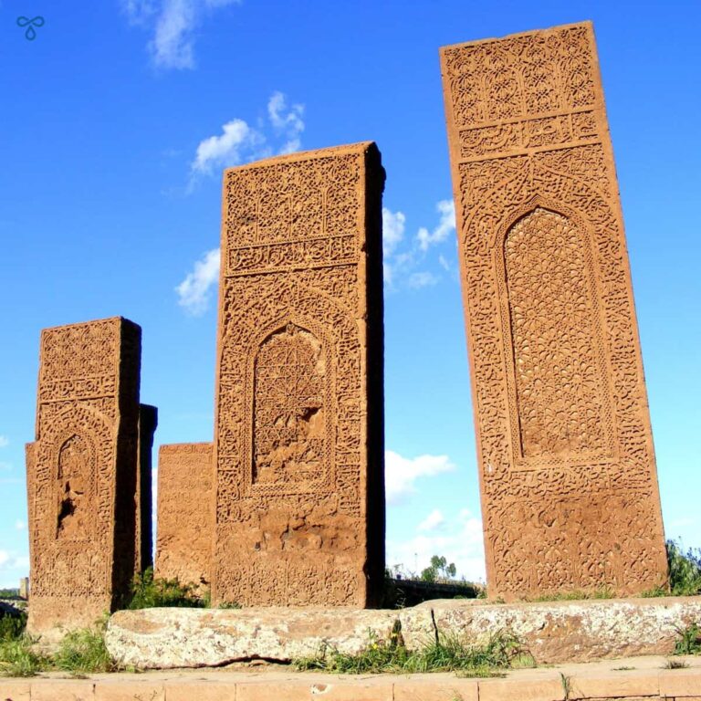 Three intricately-carved Ahlat tombstones, going up in height.