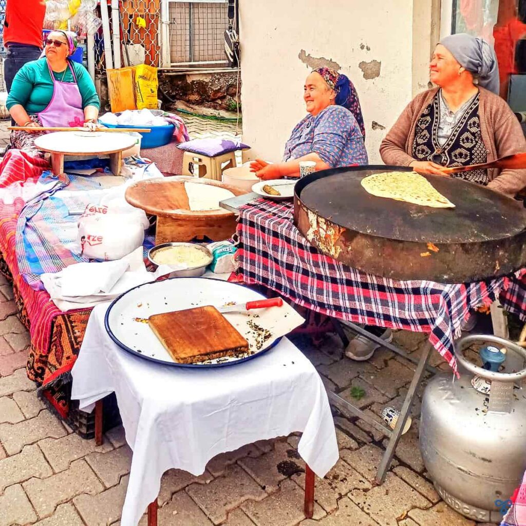 Three ladies making traditional flatbreads, g&ouml;zleme.