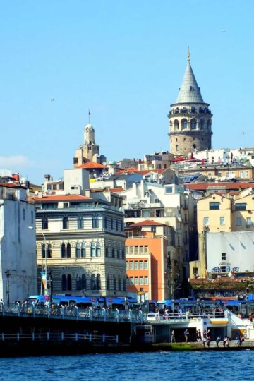 A view across the Golden Horn to Karaköy and the hillside of Galata. Galata Tower rises above into the skyline.