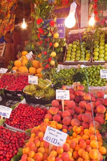Cherries, peaches and apples on a colourful stall in Kadıköy, Istanbul
