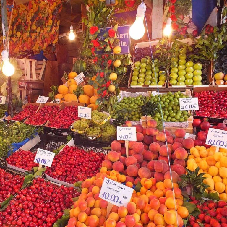 Cherries, peaches and apples on a colourful stall in Kadıköy, Istanbul