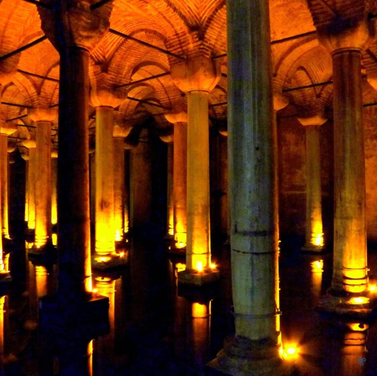 Symmetrical columns at the Basilica Cistern, Istanbul. The ceiling is arched and bricked.