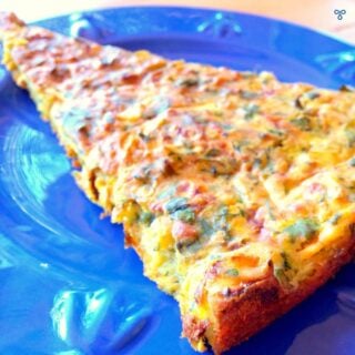 A triangular slice of oven baked fritter on a blue plate.