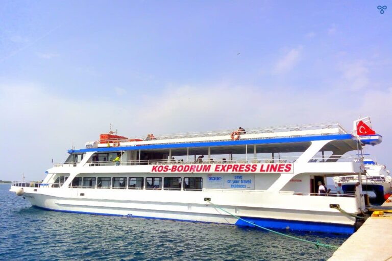 A small white passenger ferry with Kos-Bodrum Express Lines written in red letters on the side.
