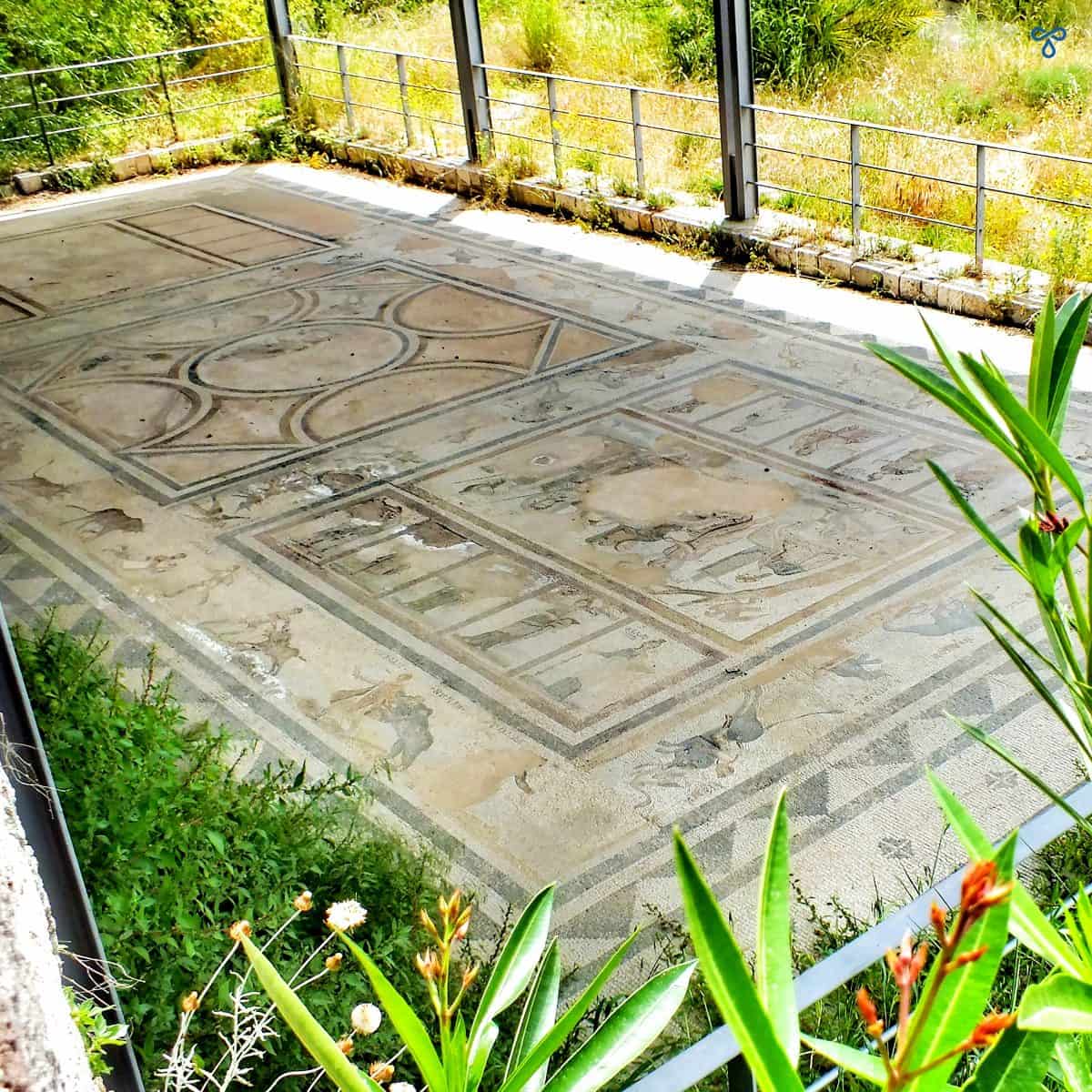 An ancient Roman mosaic with protective roof at the West Archaeological Site in Kos.