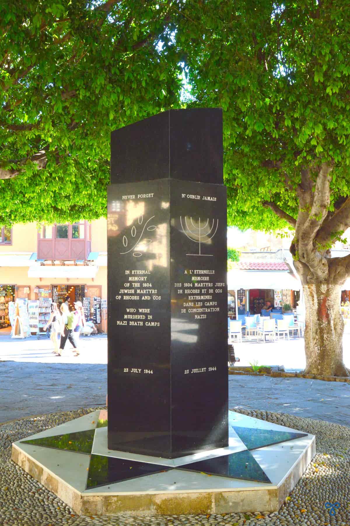 A black granite obelisk memorial to Jewish people who were murdered by the Nazis.