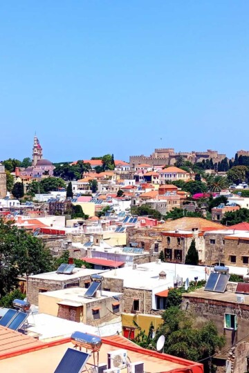 A view over the rooftops of Rhodes Old Town. The Place of the Grand Master is visible on the skyline.