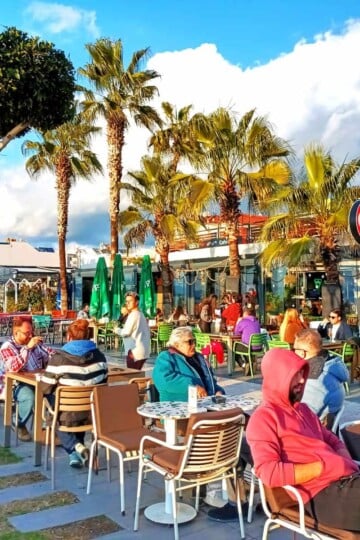 Locals Sitting Outside Calisto Pizza Restaurant In Winter