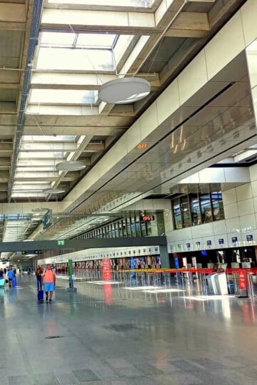 Dalaman Airport check in desks line the right of the shot.