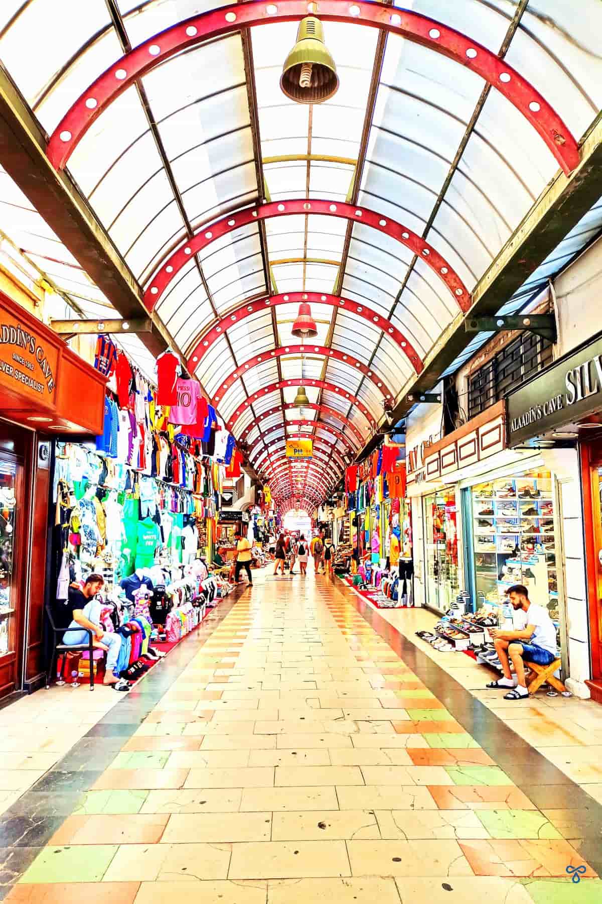 A long thin shopping arcade with curved roof in Marmaris Grand Bazaar.