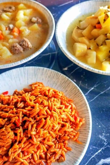 Three bowls filled with stews and and orzo.