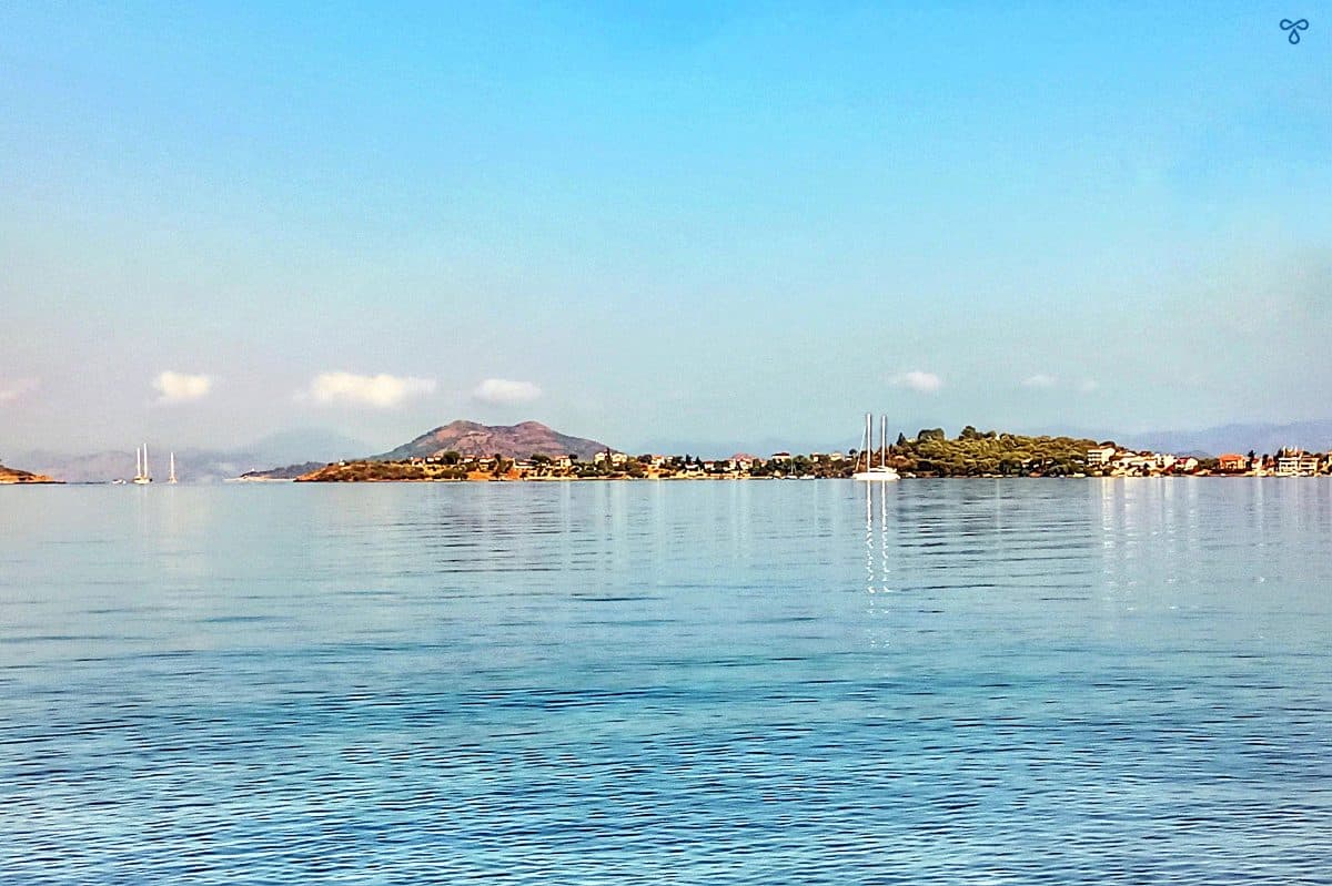 Low lying Şovalye Island divides the sea and the sky halfway down the photo.