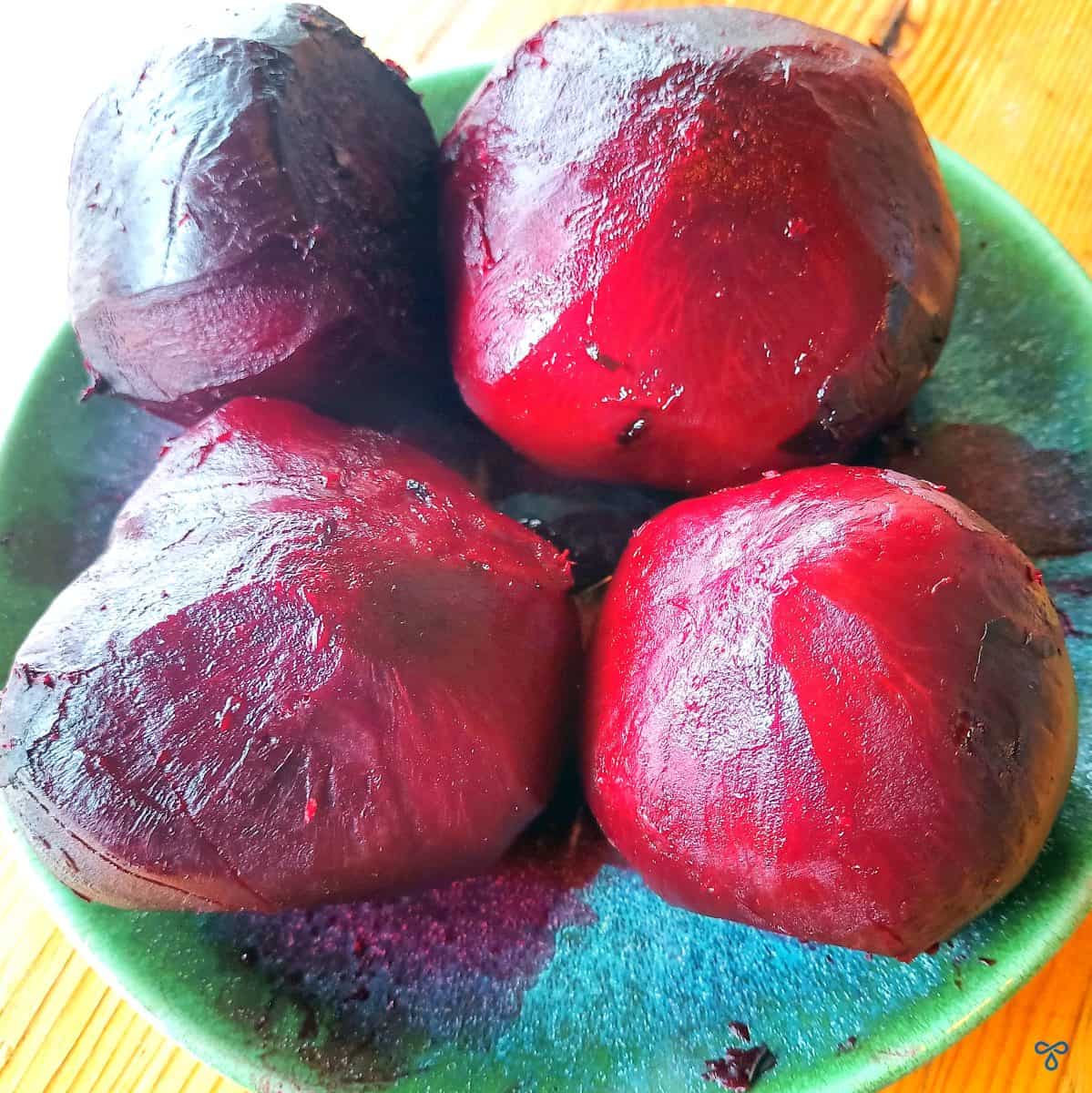 Four large cooked and peeled beetroot.