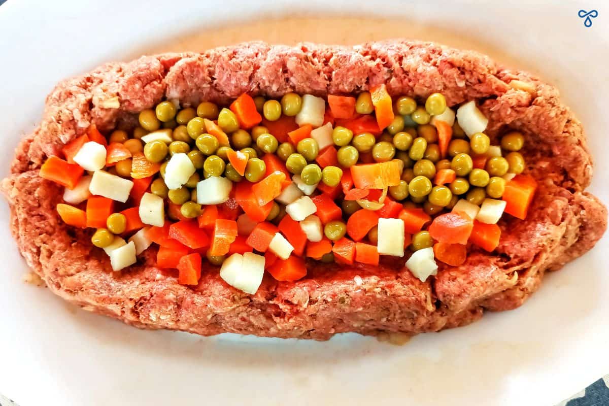 Dalyan k&ouml;fte mixture with a chopped vegetable filling in the centre.