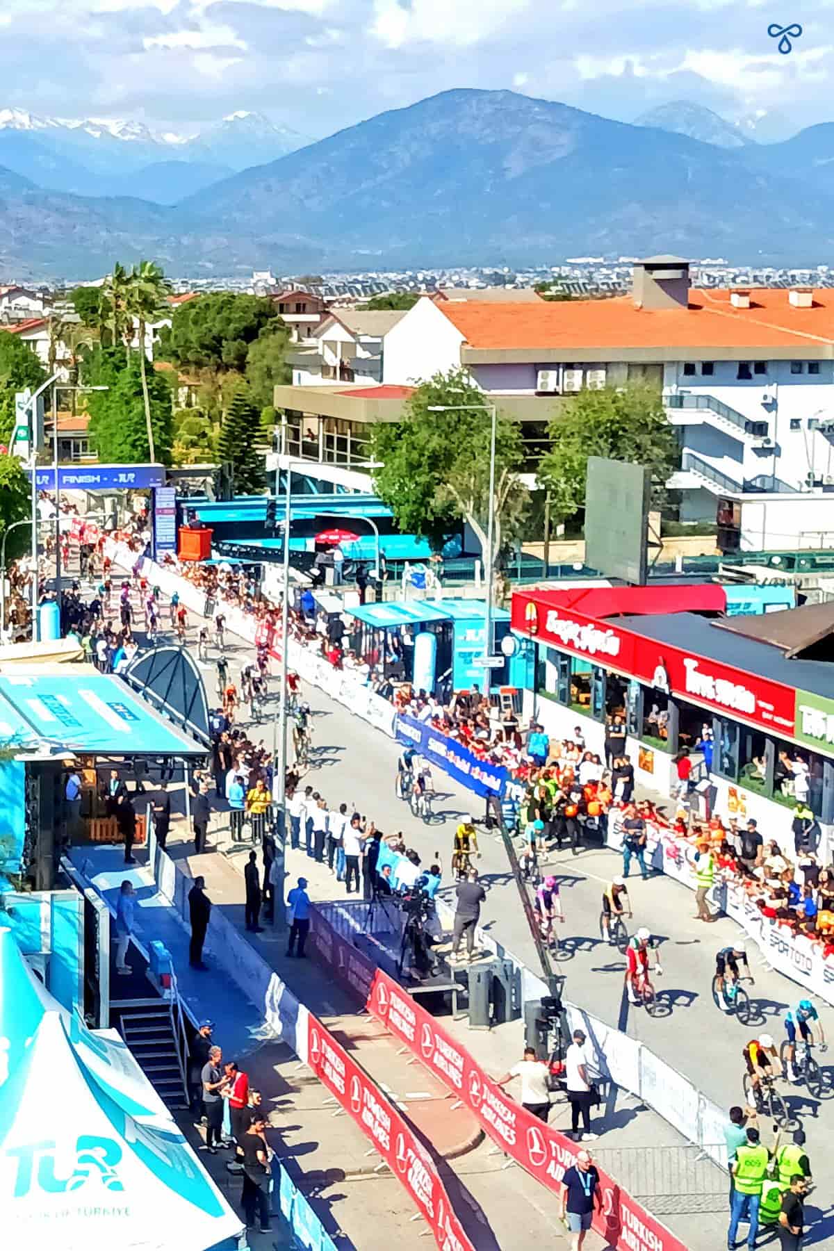 Viewed from above; cyclists coming through the finish line in Fethiye for the Presidential Cycling Tour of Turkey.
