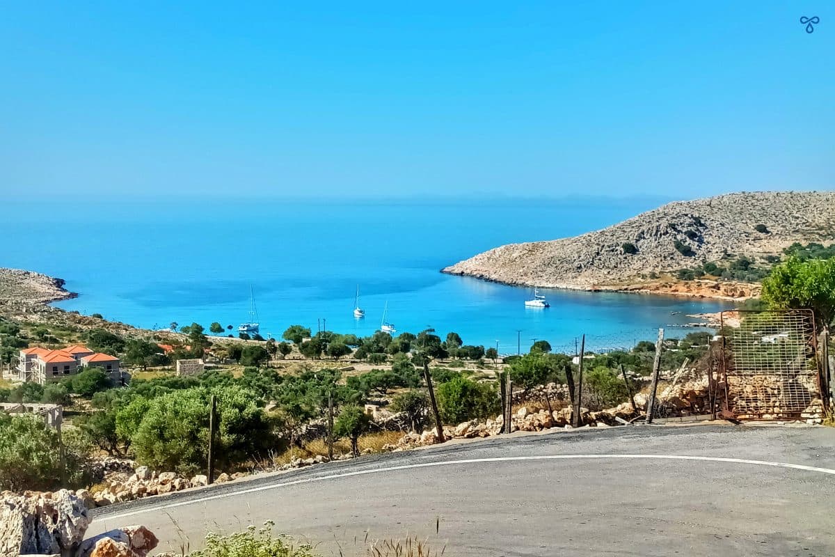 A view of the sea and coastline from a high road.