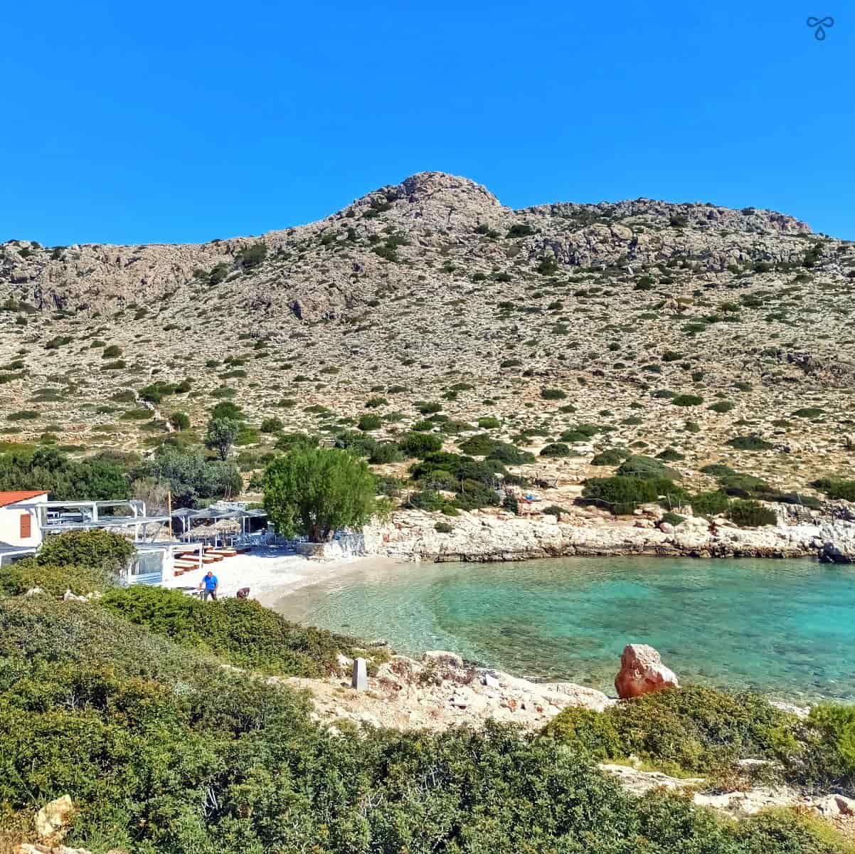 A small bay surrounded by rocky hills.
