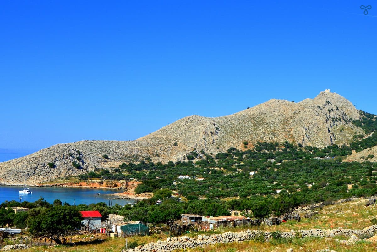 Looking towards a rugged hill topped with the ruins of the castle of the Knights of St. John on Halki Island.