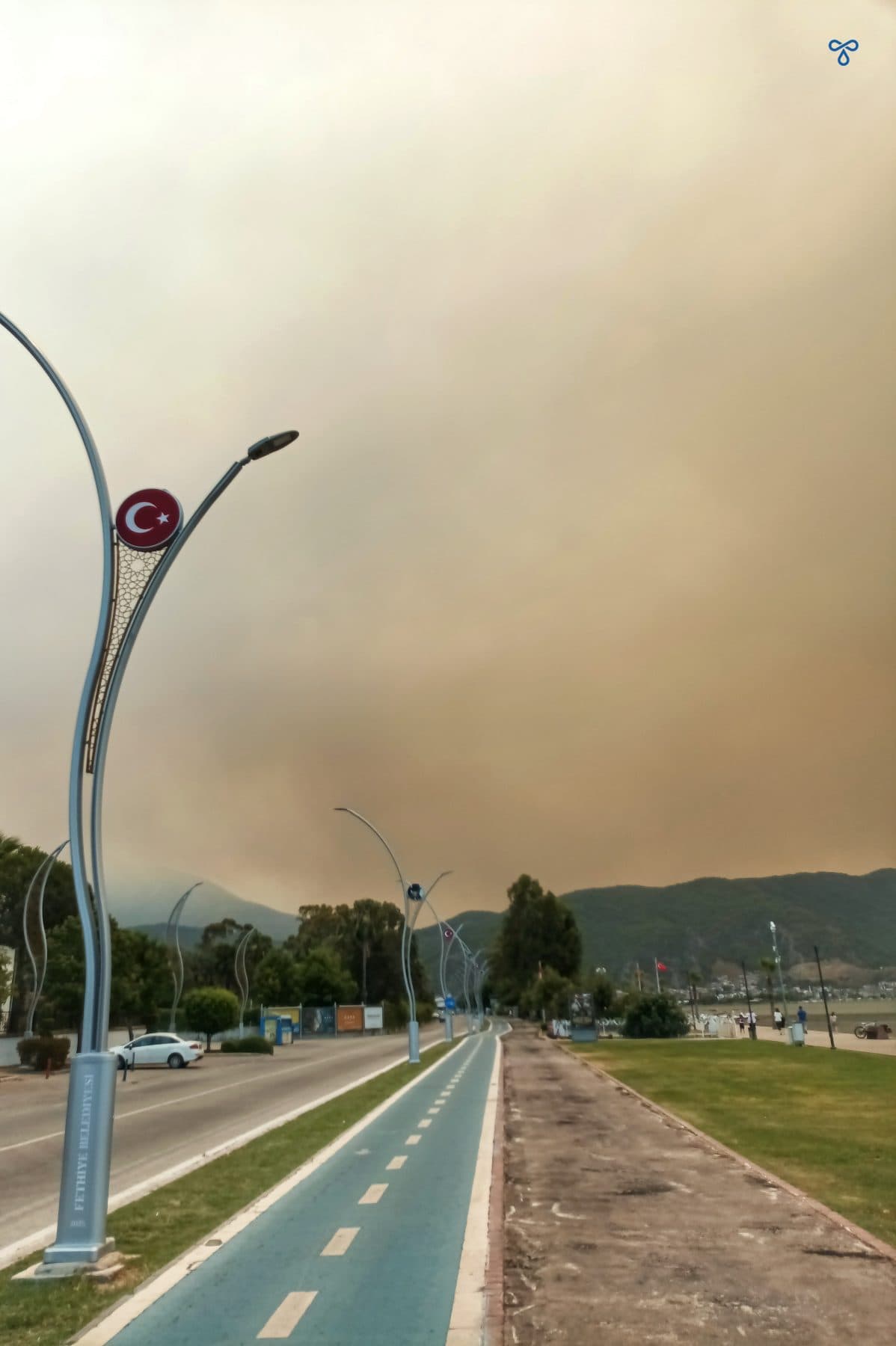 A view along the cycle track in Fethiye. The sky is dark - full of thick smoke from forest fires.