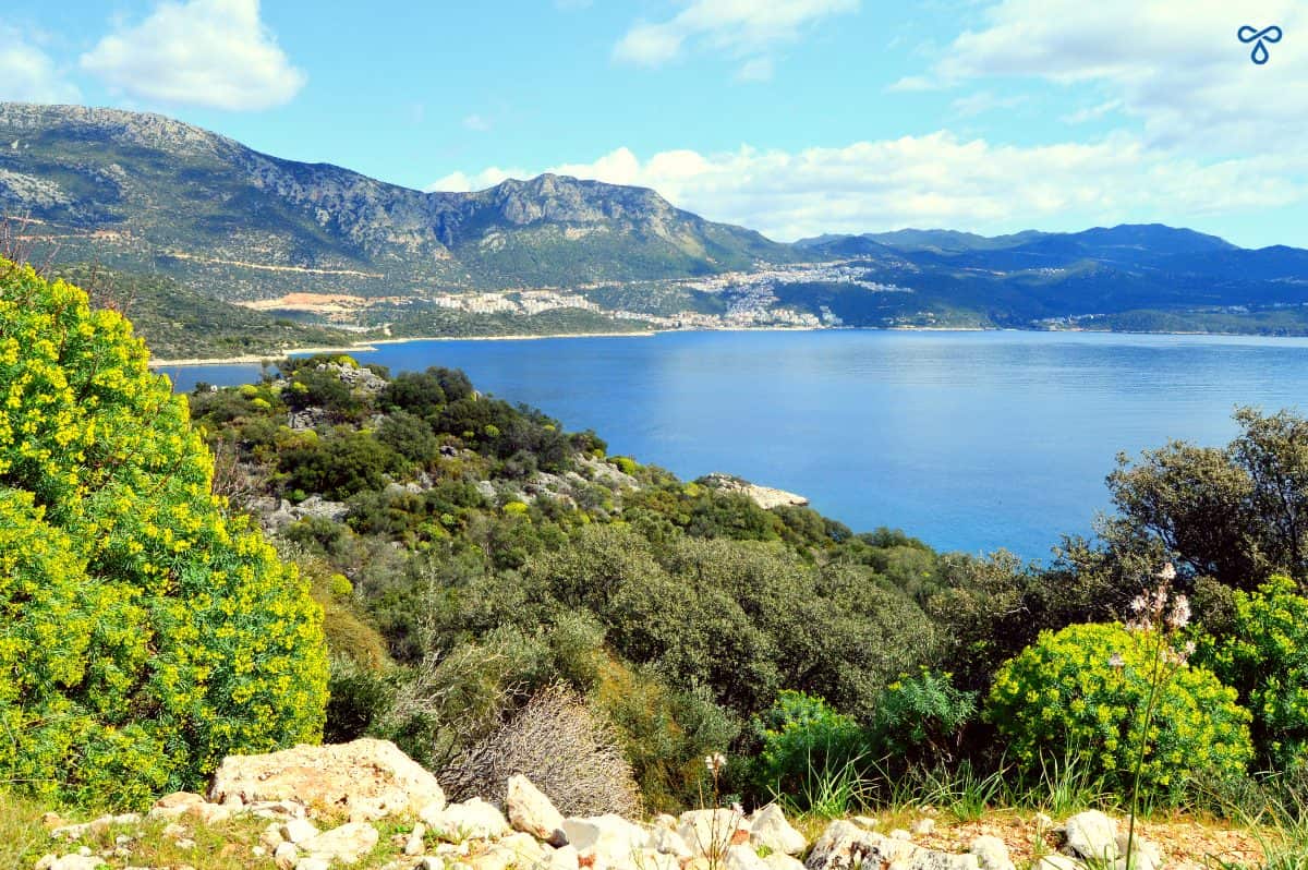 Looking over rocky greenery and the sea towards Kaş centre in the distance.