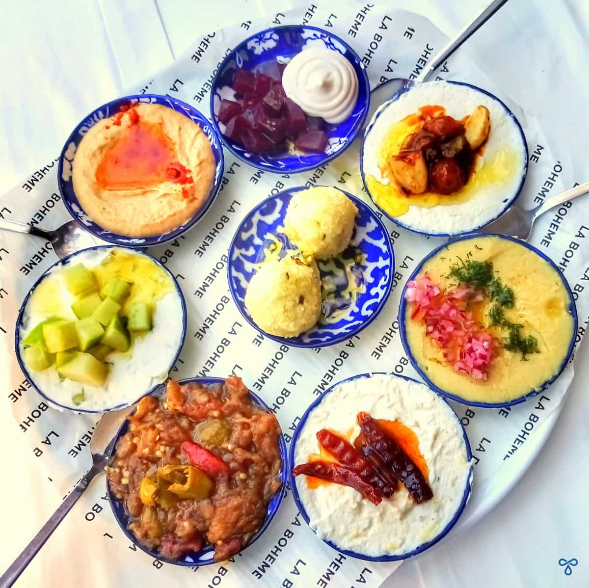 Small circular sharing plates of Turkish meze.
